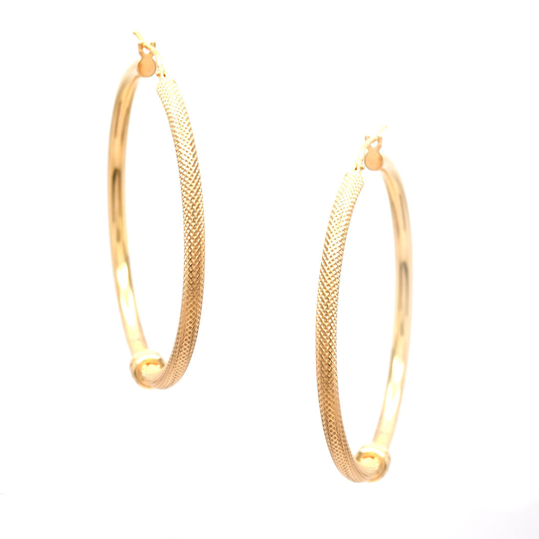 Arracadas grabada nudo grande de 10K